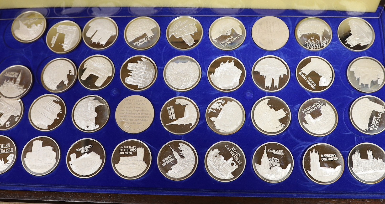 Four assorted modern cased silver ingot sets, to include 'The Beauty of Britain's Churches', 47oz, 'The Official World Wildlife Collection', 49oz, 'The Queens Beasts', 15oz and 'The Royal Standards' 3.5oz